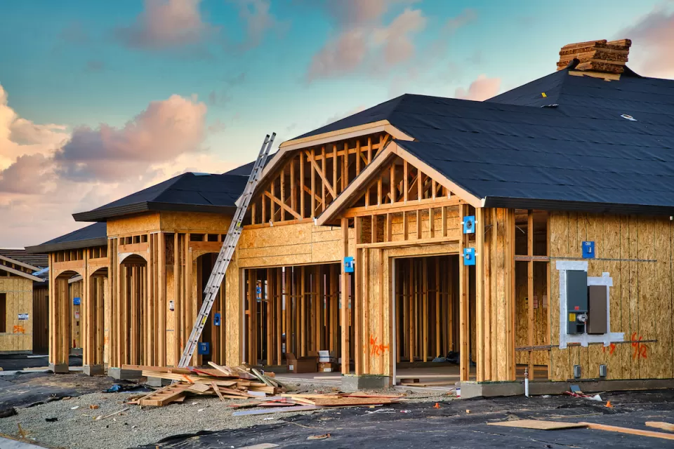 Wood-frame houses under construction.